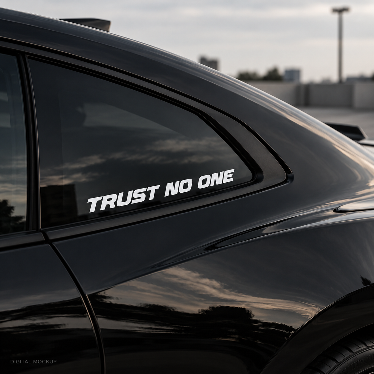 Digital mockup: Trust No One white vinyl lettering on a black car window. Illustrative placement.