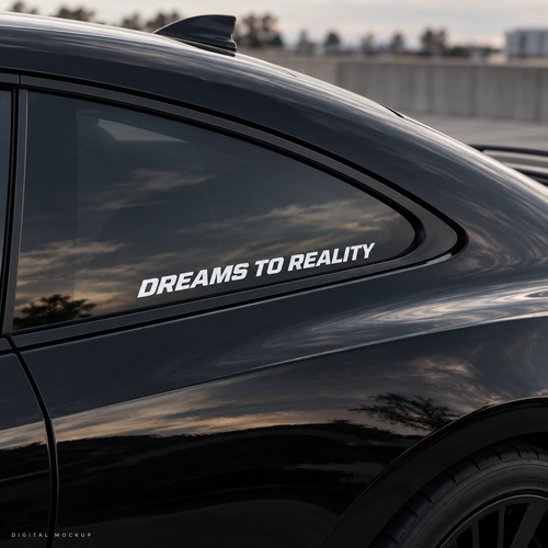 Digital mockup: Dreams To Reality white vinyl lettering on a black car window. Illustrative placement.