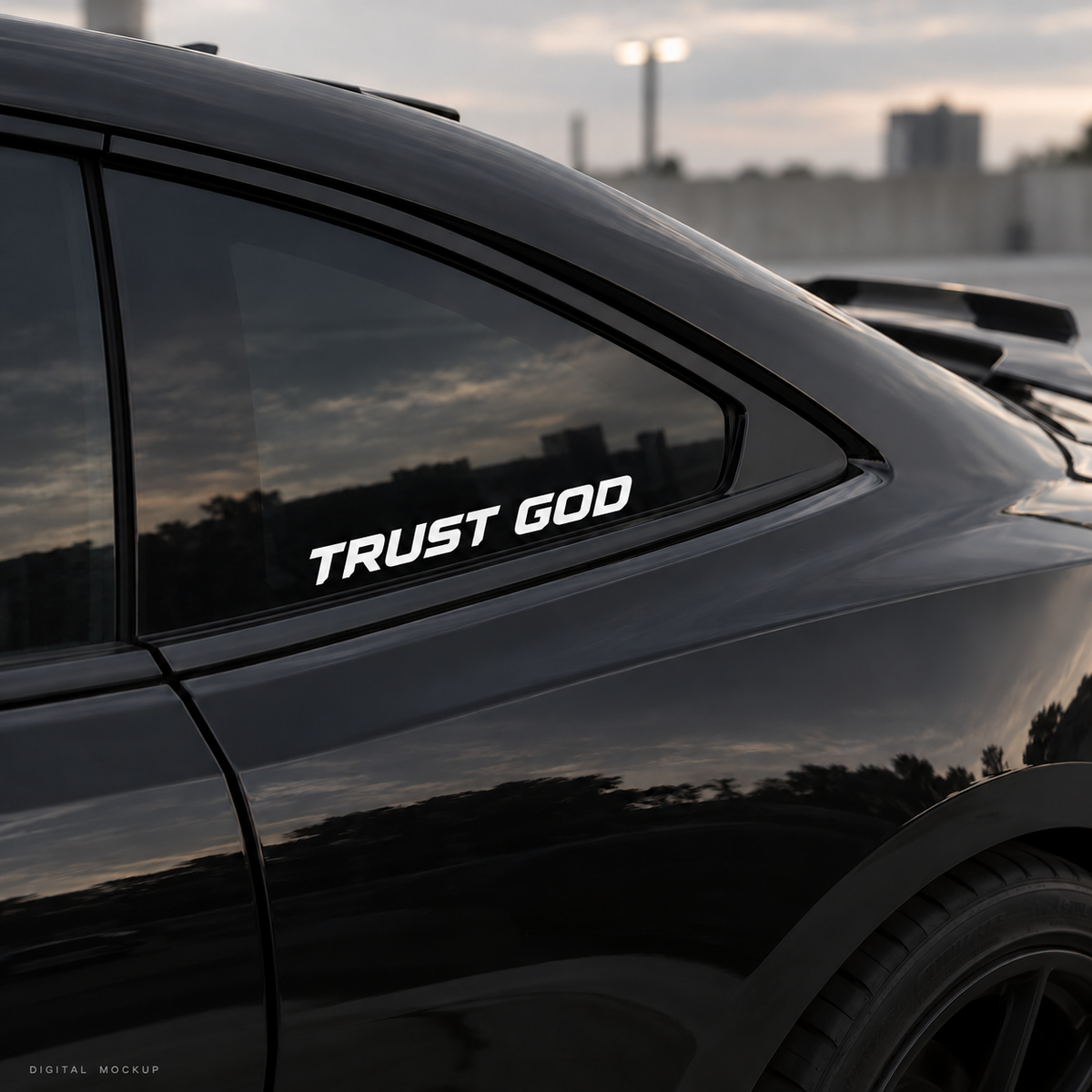 Digital mockup: Trust God white vinyl lettering on a black car window. Illustrative placement.