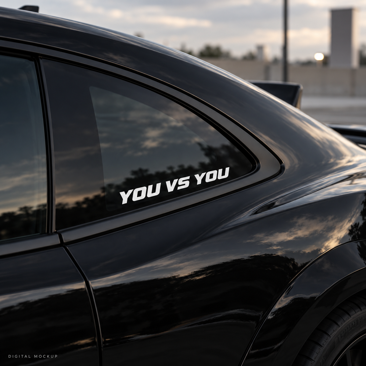 Digital mockup: You Vs You white vinyl lettering on a black car window. Illustrative placement.